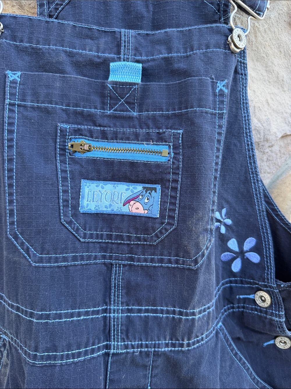 Disney Eeyore 💙 Navy Denim Cargo Short Overalls with Light Blue Floral Accents - Picture 2 of 4